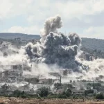 غارة جوية إسرائيلية سابقة استهدفت قرية المنصوري بالجنوب اللبناني (الفرنسية)